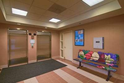 Interior view of a facility lobby with elevators