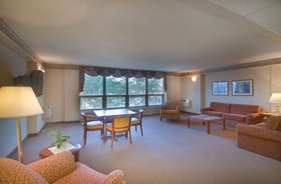 Bright interior common area with furniture and windows