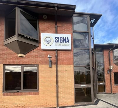 Building entrance of Signa Care Group showing the sign.