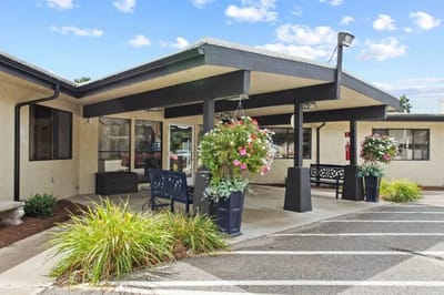 Entrance with flower pots and outdoor seating area