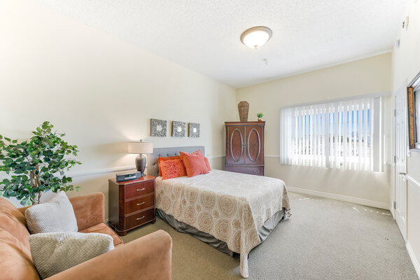 Cozy resident room with bed and decorative elements