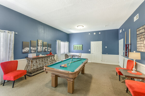 Common area with a pool table and seating
