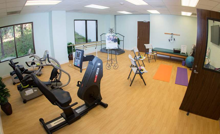 Interior fitness area with exercise equipment and mats