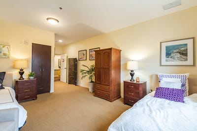 Cozy private resident room with two beds and decor