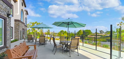 Outdoor patio with seating and umbrellas