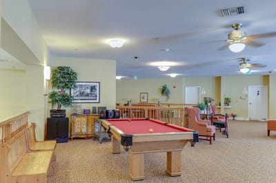 Common area with a billiard table and seating