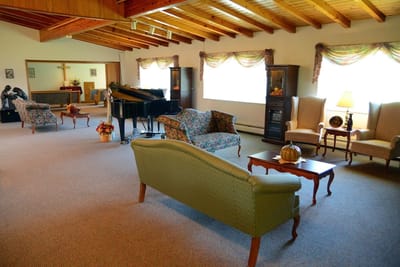 Cozy common area with seating and a piano