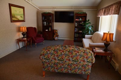 Cozy common area with seating and bookshelves