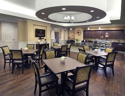 Dining area with tables and chairs in a common room