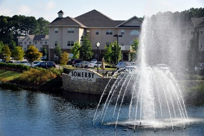 Exterior view of Somerby with fountain and signage