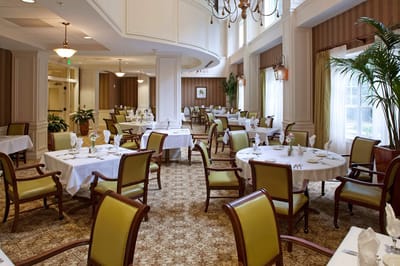 Elegant dining room with set tables and chairs