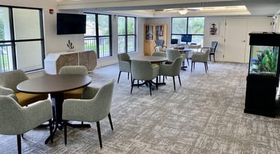 Bright common area with seating and natural light