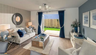 Bright living area with open doors to the garden