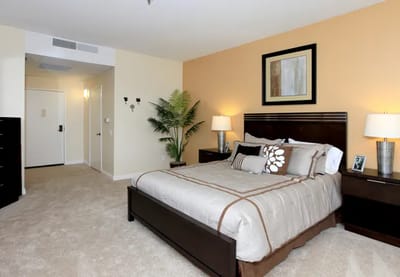 Interior view of a private resident room with a bed and decor