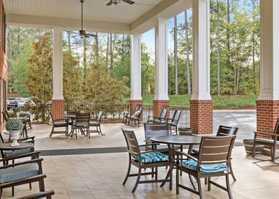Outdoor seating area with tables and chairs