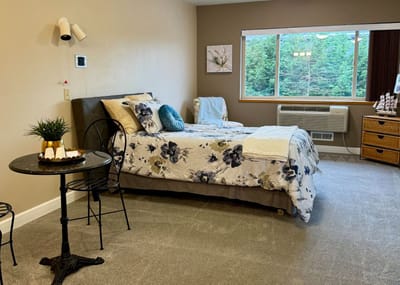Cozy bedroom with floral bedding and a view