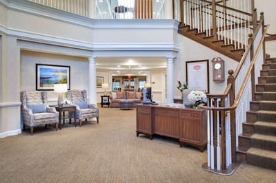 Bright interior lobby with seating and staircase