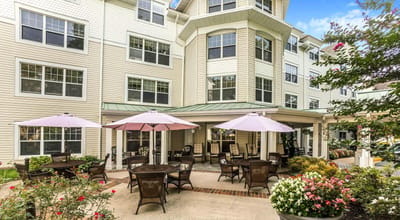 Outdoor patio area with umbrellas and seating