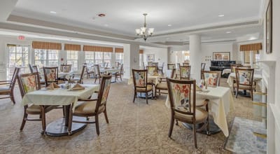 Bright dining room with tables set for meals