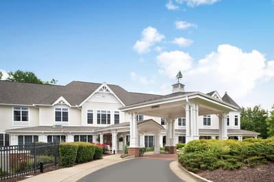 Front entrance of Sunrise at Five Forks with landscaped garden