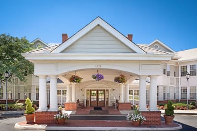 Exterior view of the building entrance with flowers