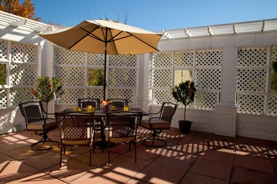 Outdoor patio area with seating and an umbrella