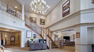 Lobby area with elegant chandelier and staircase
