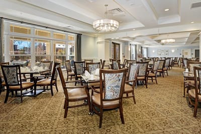 Interior view of a dining room with tables set