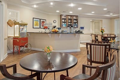Cozy dining area with coffee station and popcorn machine