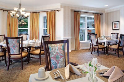 Dining area with elegantly set tables and decor