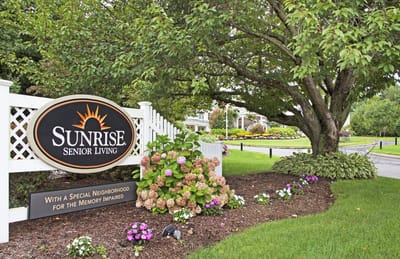 Beautifully landscaped entrance of Sunrise Senior Living