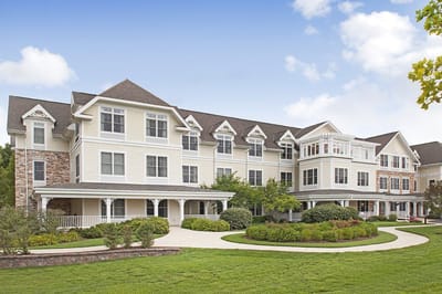 Exterior view of Sunrise of Dresher with landscaped grounds