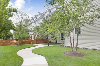 Pathway leading to a senior living community with outdoor space