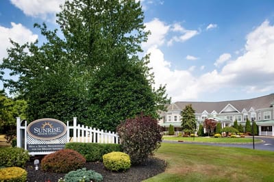 Exterior view of Sunrise of East Brunswick with landscaping