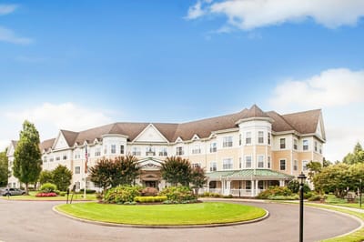 Exterior view of Sunrise of East Meadow with landscaped area