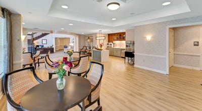 Bright common area with seating and floral arrangement