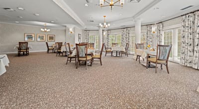 Dining room with tables set for residents