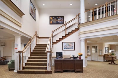 Interior view of a welcoming reception area with stairs