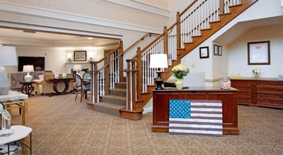 Welcoming interior of the facility lobby with stairs