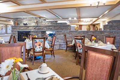 Dining room with tables set for a meal