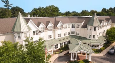 Aerial view of the building entrance with landscaped areas