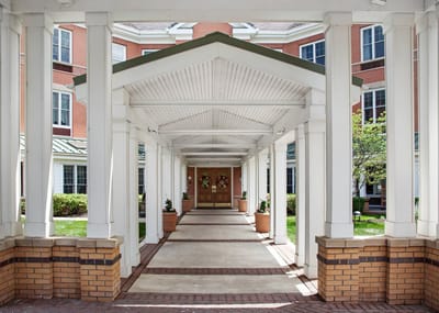 Covered walkway leading to the facility entrance