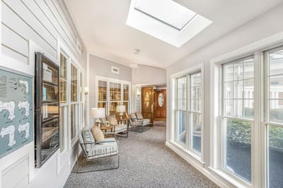 Bright hallway with comfortable seating and natural light