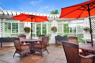 Outdoor patio with tables and umbrellas