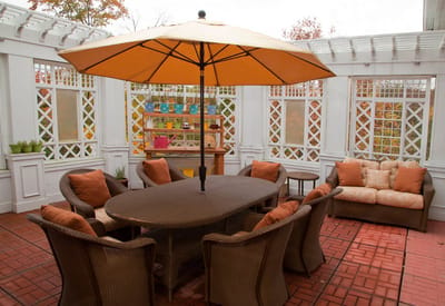 Outdoor seating area with umbrella and chairs