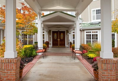 Entrance to a senior living facility with flowers