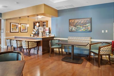 Bright common area with seating and artwork