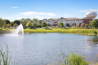 View of the facility with a pond and fountain