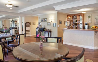 Bright dining room with tables and a service area