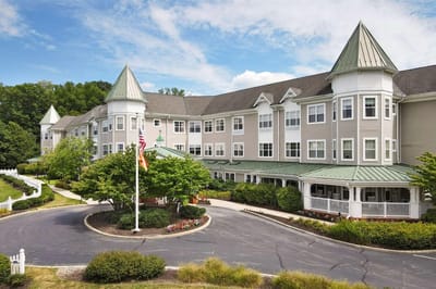 Exterior view of Sunrise of Paoli with landscaped entrance
